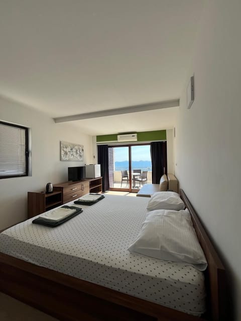 Family Quadruple Room, Sea View | Minibar, in-room safe, soundproofing, free WiFi