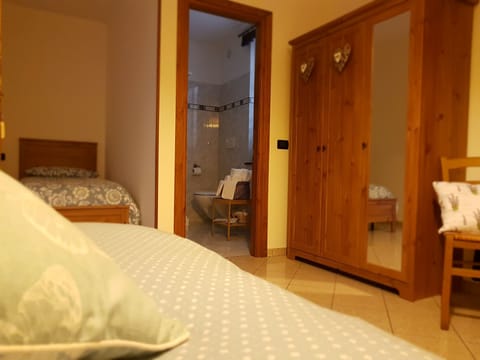 Quadruple Room | 1 bedroom, down comforters, desk, blackout drapes