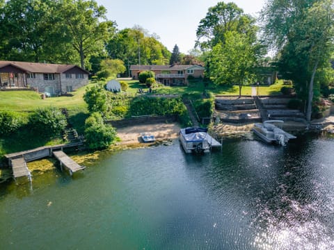 Private beach overlooking the swimming hole on “The Venice of Paw Paw Lake”