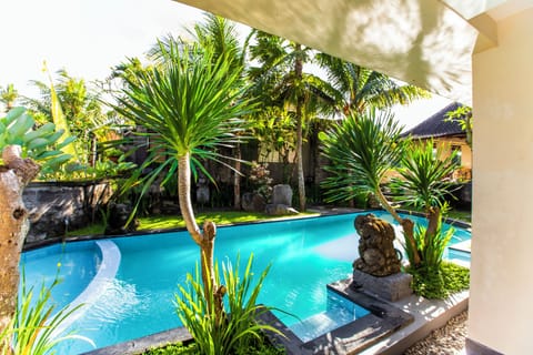 Deluxe Room, Pool View | 1 bedroom, individually decorated, individually furnished, desk