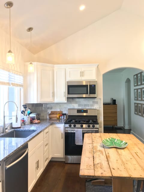 Kitchen has an island, large counterspace, new SS appliances (gas range, DW)