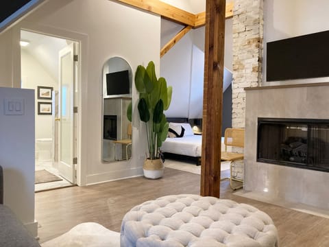 Attic en-suite, smart TV, gas fireplace, dry bar, walk in shower, heated floors