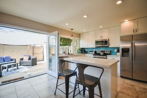 Kitchen french doors open to patio