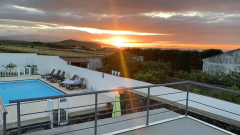 Beautiful sunset view from the balcony above the pool