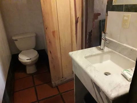 Family Room, Multiple Beds | Bathroom | Shower, rainfall showerhead, designer toiletries, towels