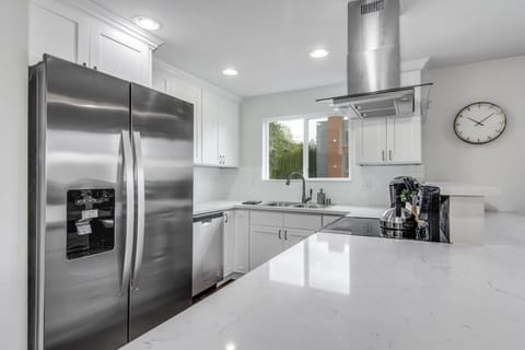 Large fridge and sink great kitchen with updated quartz and finishes throughout.