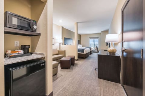 Suite, Multiple Beds, Non Smoking | Desk, laptop workspace, blackout drapes, iron/ironing board