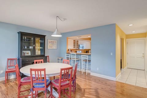 - Fun and functional dining room flows easily into the sunny open concept kitchen
- Bar stools at the pass through counter make casual meals and snacks easy
- Wood floors and colorful touches give this space personality and warmth