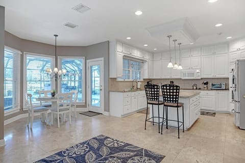 - Bright kitchen layout with island seating, pendant lights, and a cozy breakfast nook
- Enjoy your coffee beside panoramic bay windows with peaceful outdoor views
- Perfect mix of comfort and function for morning meals or evening prep