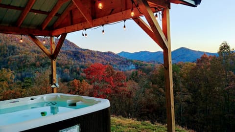 Relax in the covered hot tub with astounding views. String Lights.