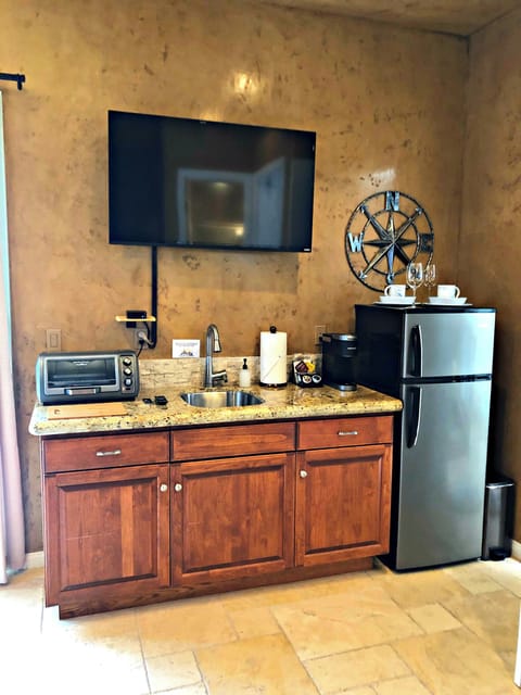 Downstairs guest suite with small kitchen area.