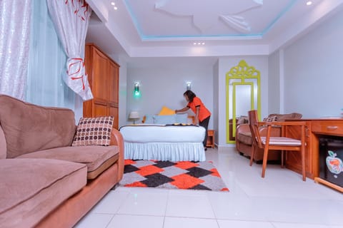 Deluxe Room | Laptop workspace, blackout drapes, rollaway beds, free WiFi