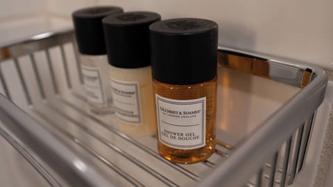 Shower, designer toiletries, hair dryer, bathrobes