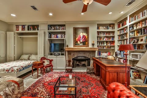 panorama of living room, working fireplace, antique desk, Queensize Murphy Bed