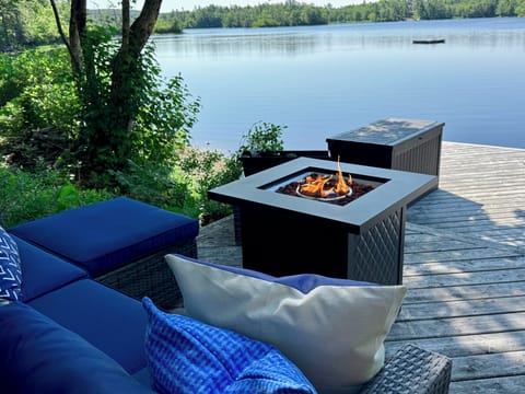 Our new outdoor coach and fireplace. Comfy. 
