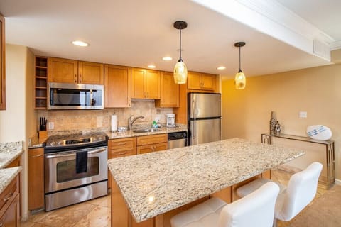 Enjoy cooking at your fully equipped kitchen with a kitchen island for easy meal preparation