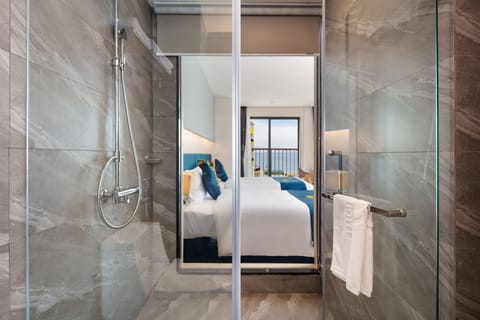 Deluxe Room, Balcony, Sea View | Minibar, in-room safe, desk, free WiFi