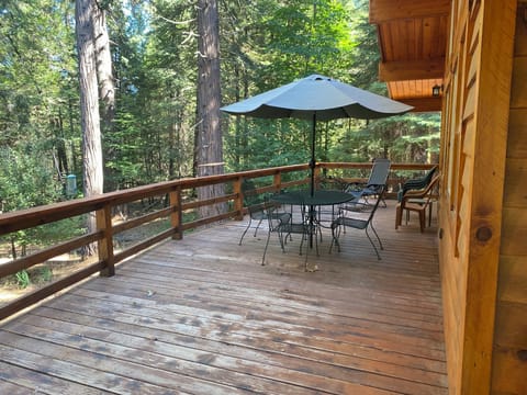 Spacious deck with forest view.  Enjoy your morning coffee or a quiet evening