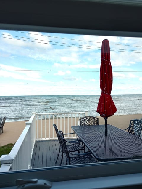 from kitchen overlooking deck, beach, and Lake Huron....