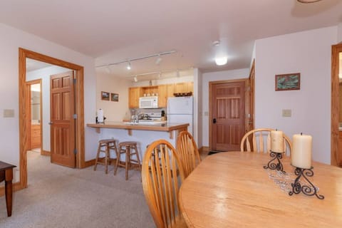 View of dining room table and kitchen