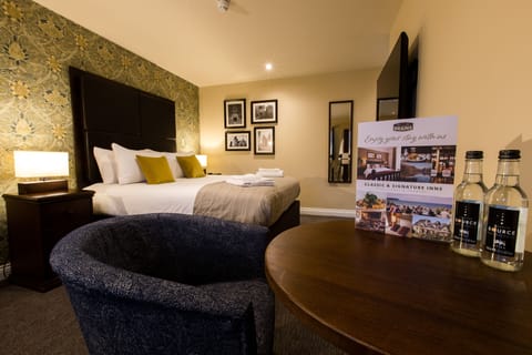 Select Comfort beds, desk, laptop workspace, iron/ironing board