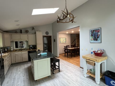 Kitchen with view of laundry room and dining room.