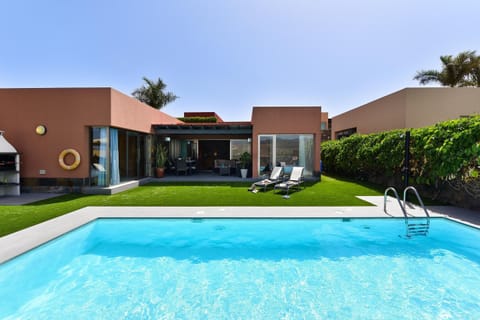 Outdoor pool, a heated pool, sun loungers