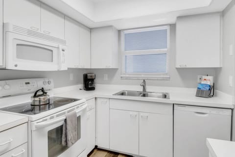 Kitchen island is nice for extra counter space.