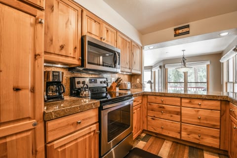 Kitchen with coffee maker perfect for early mornings