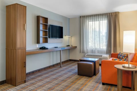 Desk, laptop workspace, blackout drapes, iron/ironing board