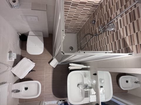 Shower, free toiletries, hair dryer, slippers