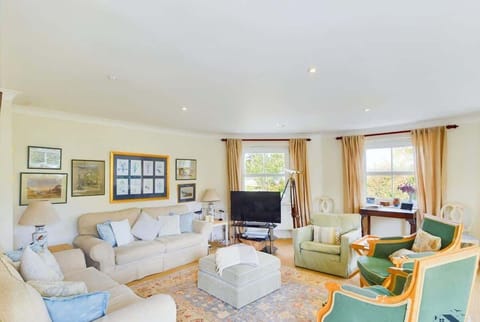 The bright first-floor living room features panoramic sea views.