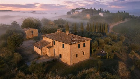 Aerial view of the house and surrounding landscape 