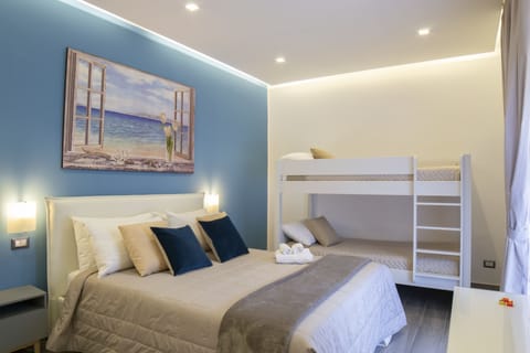 Deluxe Quadruple Room, City View (Stanza Acqua) | Premium bedding, down comforters, memory foam beds, minibar