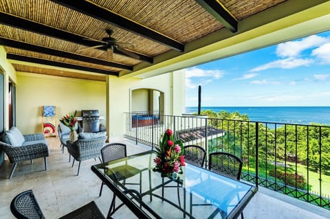 Expansive beachfront balcony with panoramic ocean views, elegant tile flooring, and space to relax or dine al fresco. Perfect for soaking in Tamarindo sunsets and coastal breezes in the exclusive Langosta neighborhood.