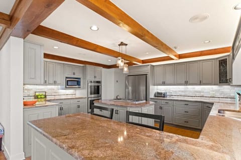 The Bar in the Kitchen has an Additional Two Seats for Dining