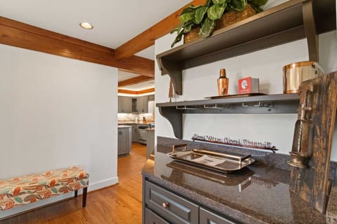Dry Bar with Wine Glasses Located in the Hallway