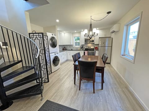 Luxury vinyl plank flooring, custom lighting, Iron Shop large spiral staircase