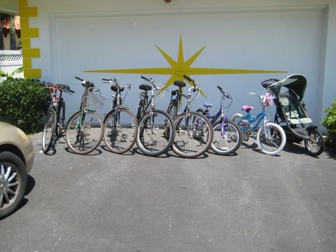 Bikes and strollers in front of 2-car garage.