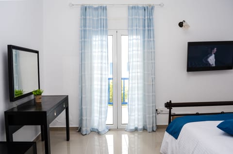 Comfort Apartment | Living area | TV