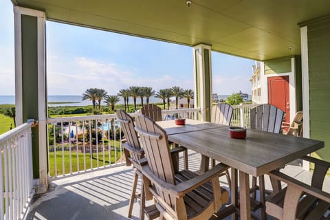 Outside seating looks toward the pool area and Galveston Bay.