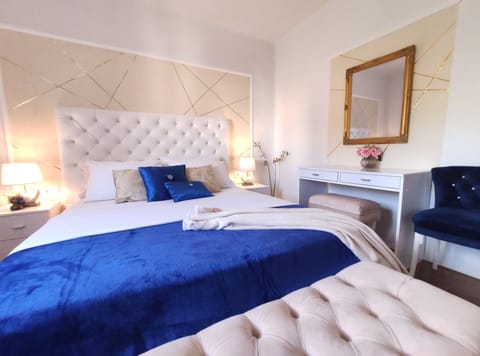 Deluxe Apartment, 2 Bedrooms, Balcony | 2 bedrooms, desk, laptop workspace, iron/ironing board