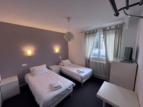Twin Room, Private Bathroom | Blackout drapes, iron/ironing board, free WiFi, bed sheets