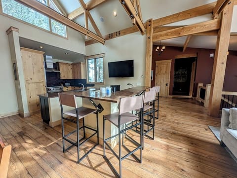 Kitchen with a large flat screen TV
