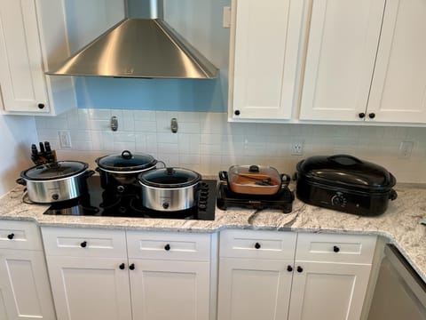 crock pots, 1 griddle, 1 skillet, 1 electric roasters. A rare find in a rental