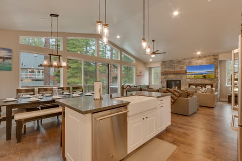 - Dining area for large groups  
- Open kitchen and forest views  
- Family-friendly cabin near Tahoe