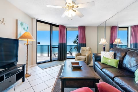 Spacious Living Room with Queen Size Sleeper Sofa offers Comfortable Seating, Beachfront Views and Balcony Access
