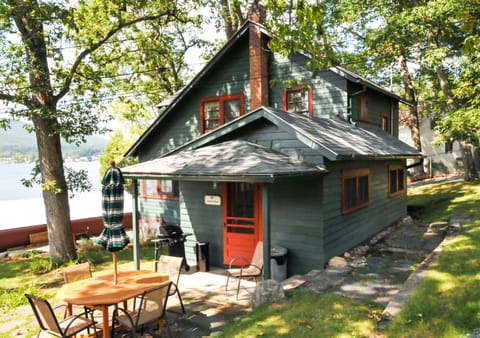 Side entrance to Crawford. BBQ grill, fire pit, and patio are near this space.