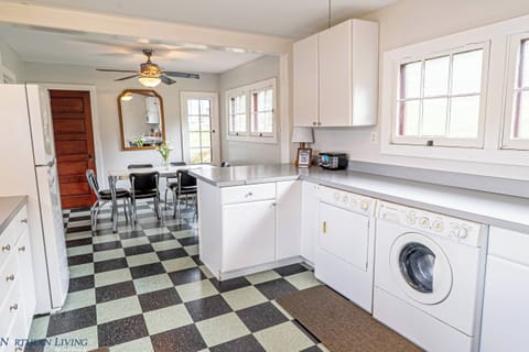 A washer and dryer are located in the kitchen of the home. 