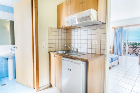 Studio, Sea View | Private kitchenette | Full-size fridge, stovetop, coffee/tea maker, electric kettle